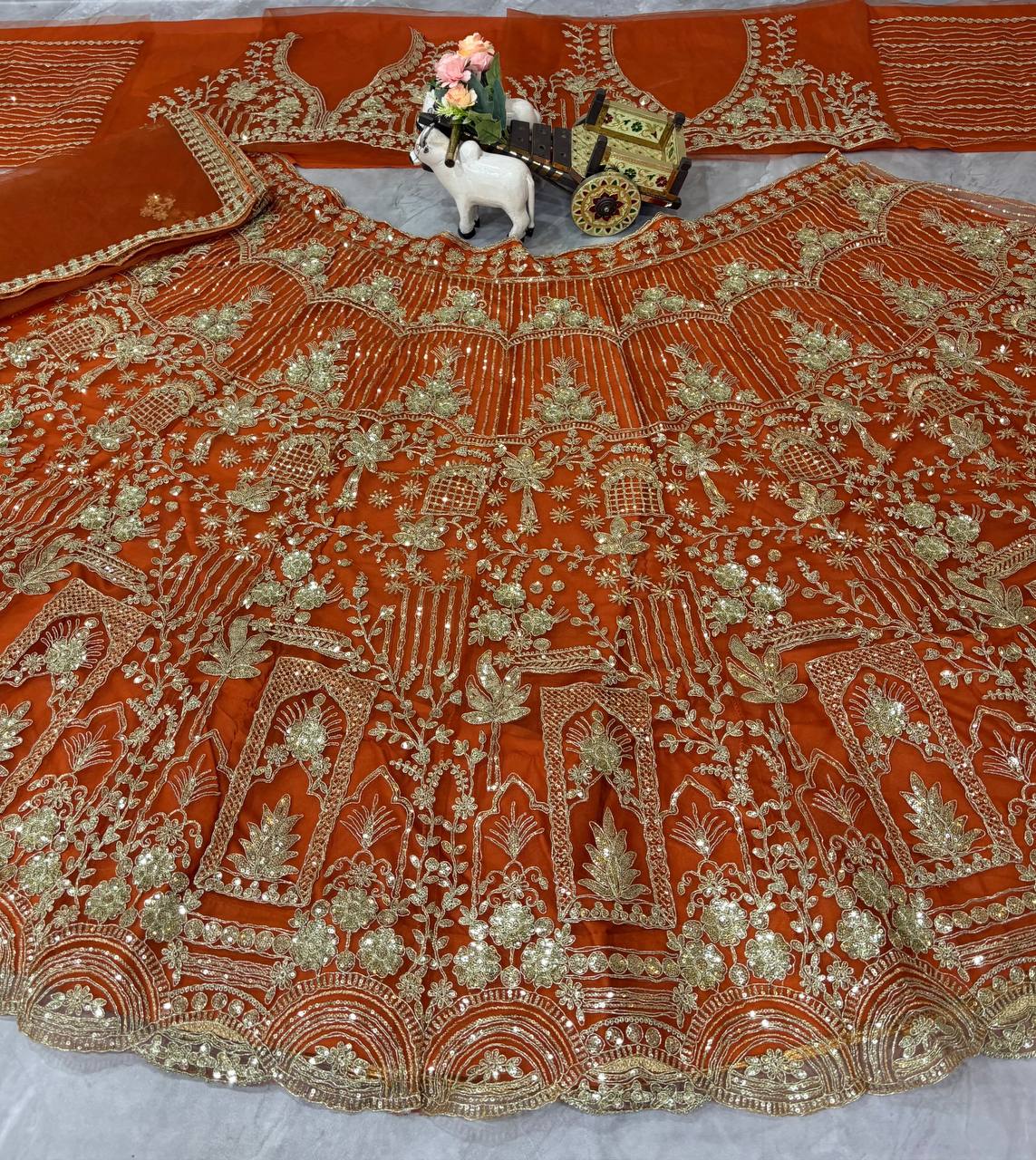 orrange colour Heavy Embroidered Lehenga Set with Golden Zari and Sequin Work