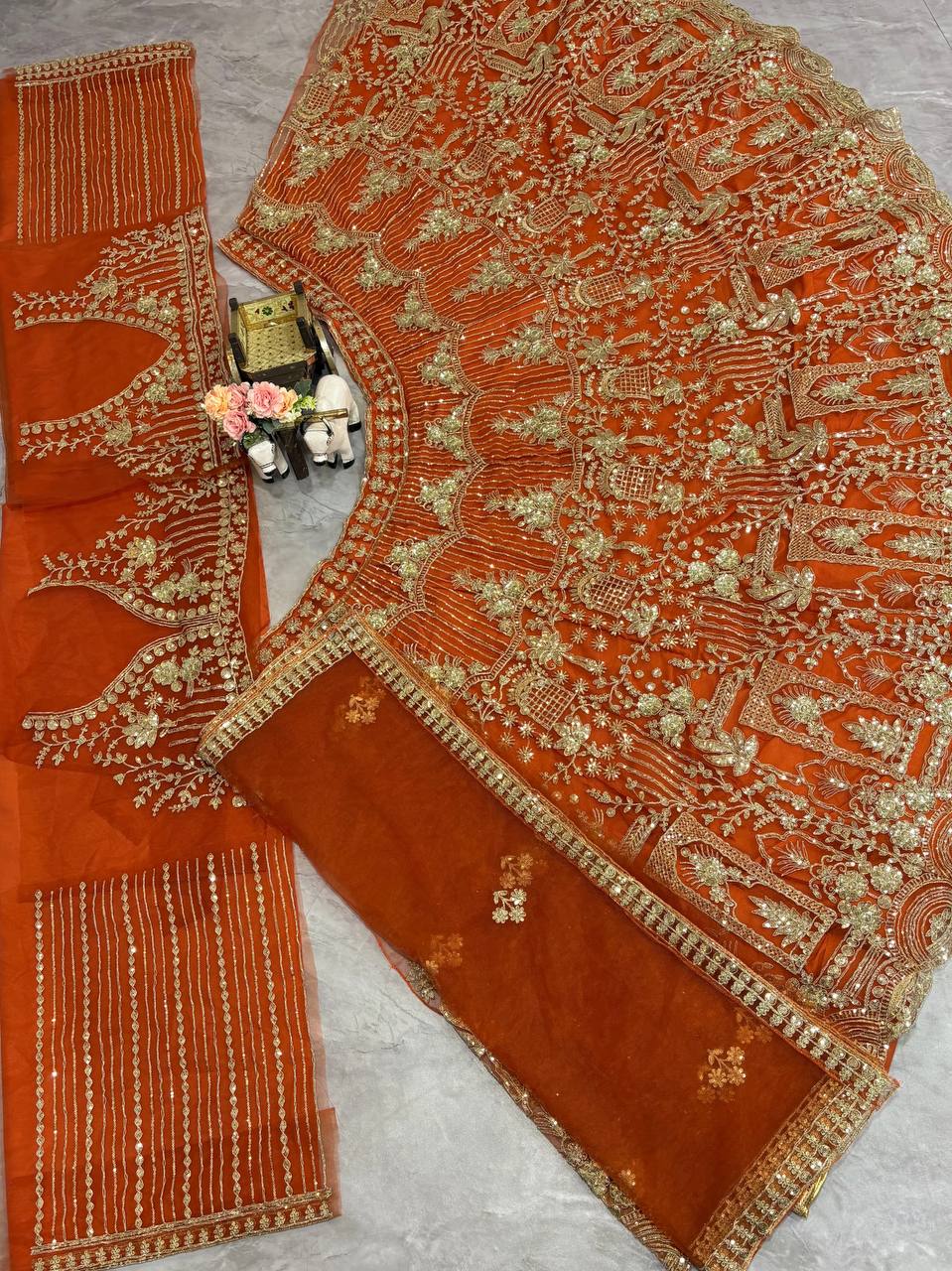 orrange colour Heavy Embroidered Lehenga Set with Golden Zari and Sequin Work