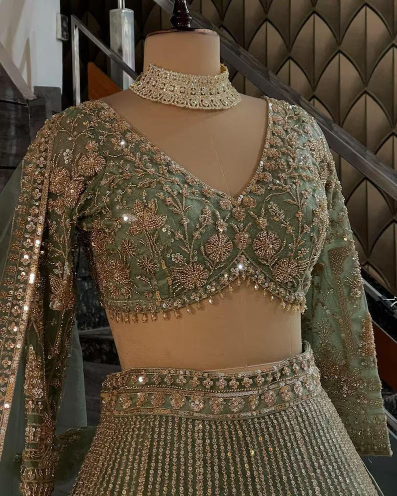 pista colour Heavy Embroidered Lehenga Set with Golden Zari and Sequin Work