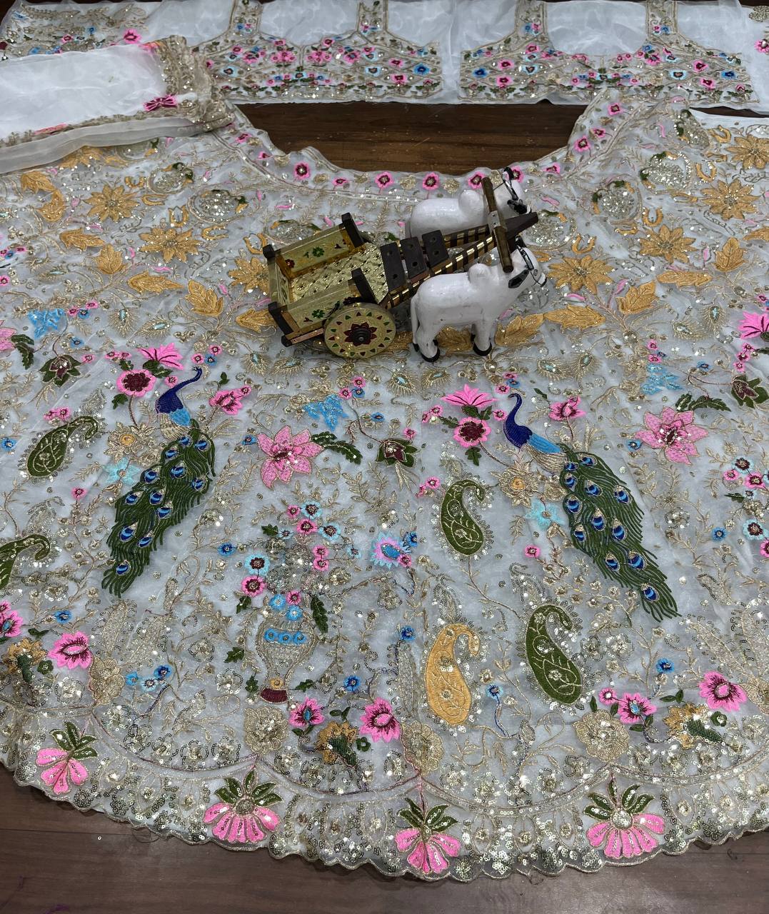 White Net Lehenga Choli with Colorful Peacock & Floral Embroidery